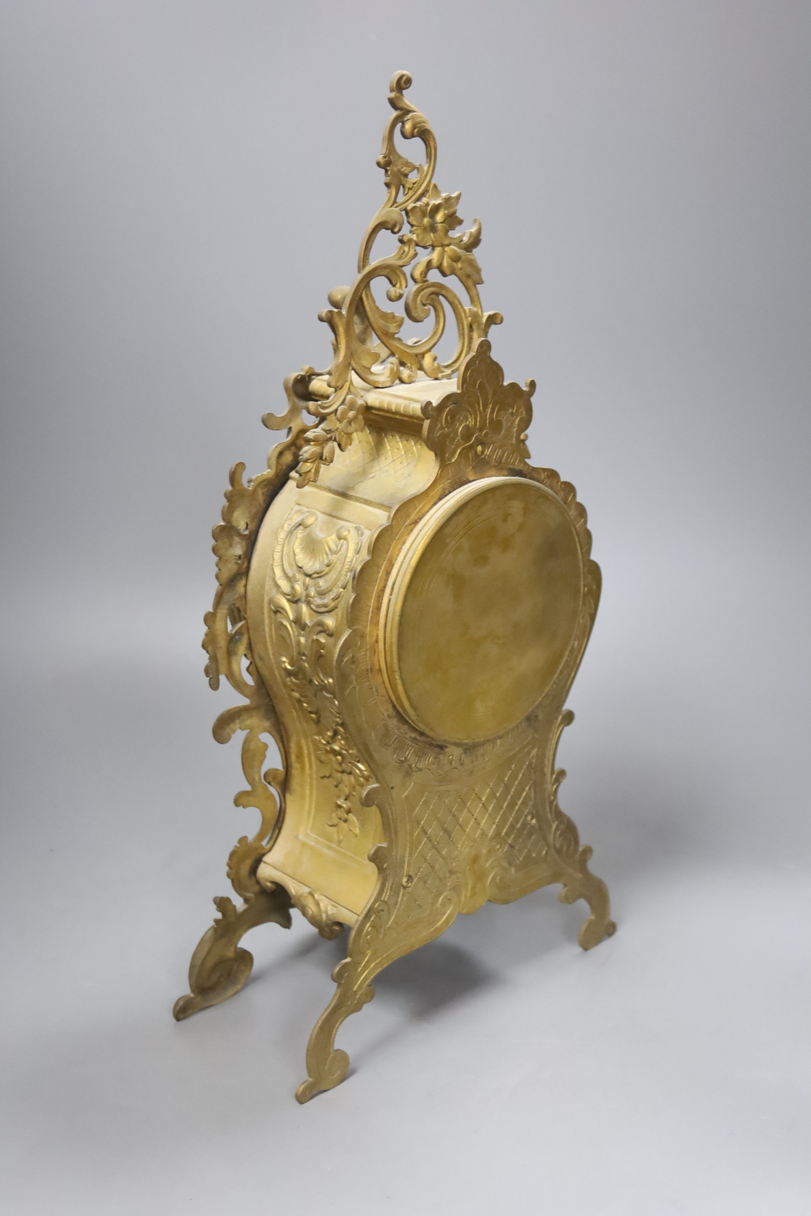 A late 19th century French gilt brass mantel clock, 40 cm high.